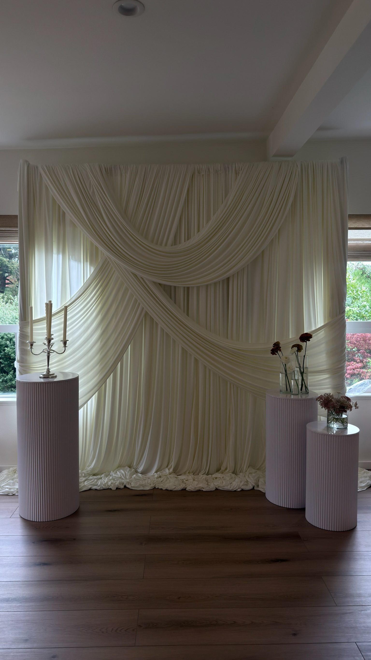 Ivory draping with pleated pedestal columns